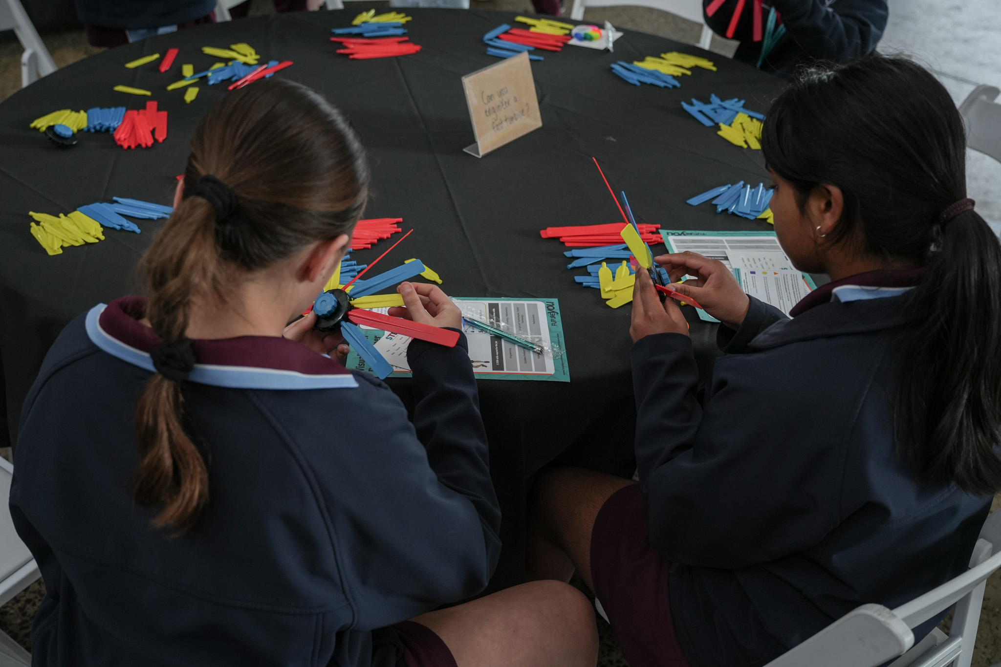 Two children building a turbine out of recycled materials at Hydro Tasmania's stall at the Festival of Bright Ideas.