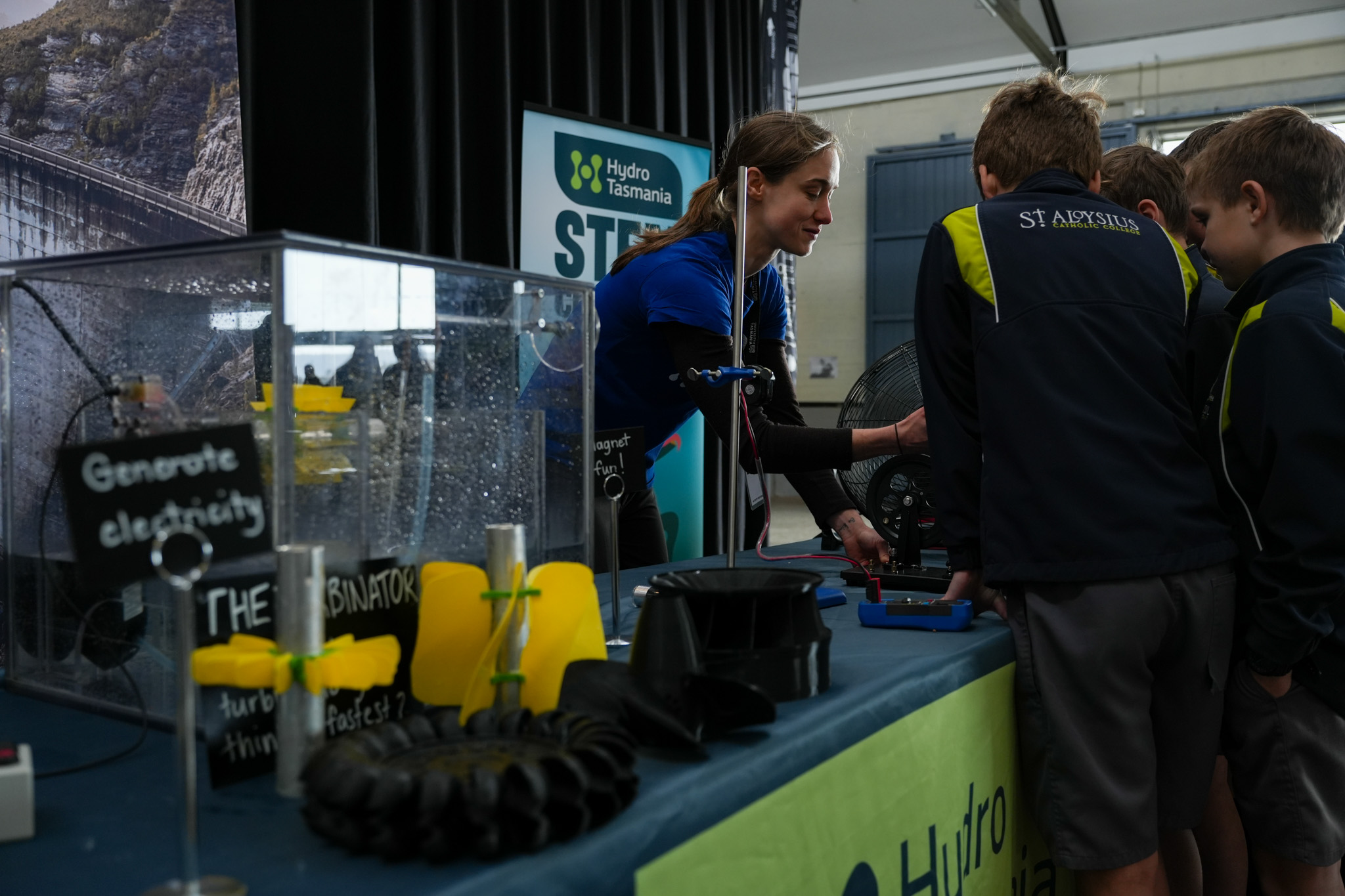 Children learning how renewable energy works at Hydro Tasmania's stall at the Festival of Bright Ideas.