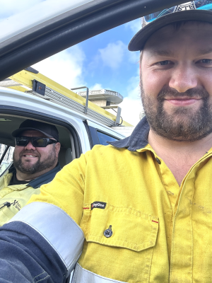 A man wearing hi vis taking a selfie