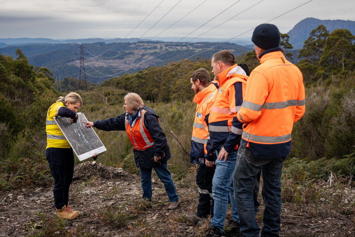 A group of people looking at a map