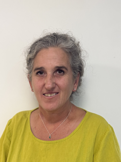 Lady in yellow top smiling