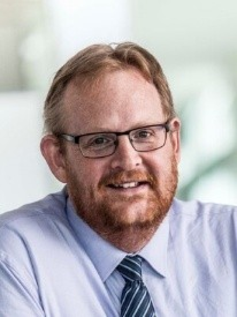 Man with glasses, tie and red hair