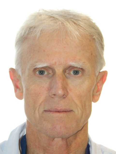 man with sandy blond hair and blue eyes