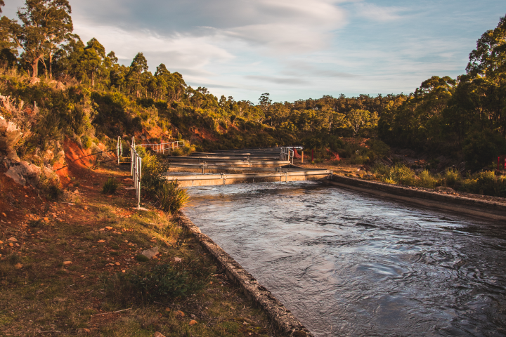 Canal full of water with blue sky in the background