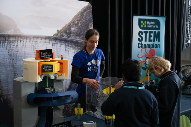 Generation Hydro's Education Officer, Rose Fuggle, at Hydro Tasmania's stall at the Festival of Bright Ideas, engaging children in renewable energy activities.